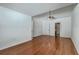 Large bedroom boasts hardwood floors, ceiling fan, and a view into an ensuite bathroom at 1436 Harbor Mist Ct, Charleston, SC 29492