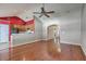Open-concept living room featuring hardwood floors, a ceiling fan, and a partial view into the adjacent kitchen at 1436 Harbor Mist Ct, Charleston, SC 29492