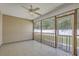 Relaxing screened-in porch with ceiling fan and tile flooring at 1436 Harbor Mist Ct, Charleston, SC 29492