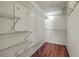 Organized walk-in closet featuring wire shelving and wooden flooring at 1436 Harbor Mist Ct, Charleston, SC 29492