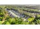 An aerial view of a suburban neighborhood showcasing modern homes nestled within lush, green surroundings at 149 Caleb Ct, Ladson, SC 29456