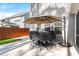 Backyard featuring a patio set with umbrella on a large concrete patio at 149 Caleb Ct, Ladson, SC 29456