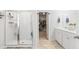 Bathroom featuring a glass-enclosed shower, double vanity, and access to the walk-in closet at 149 Caleb Ct, Ladson, SC 29456