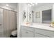 Bathroom features a shower with curtain, vanity, mirror, and neutral decor for a tranquil retreat at 149 Caleb Ct, Ladson, SC 29456
