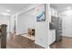 Open dining area showcasing wood floors, an adjacent pantry, and leading into the entryway at 149 Caleb Ct, Ladson, SC 29456