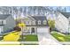 Charming two-story home with grey siding, a manicured lawn, and a welcoming front porch at 149 Caleb Ct, Ladson, SC 29456