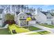 A charming two-story home boasts manicured lawns and a cozy seating area on the front porch at 149 Caleb Ct, Ladson, SC 29456