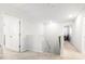 Bright hallway with neutral carpeting, white walls, and access to multiple rooms at 149 Caleb Ct, Ladson, SC 29456