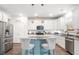 Beautiful kitchen features stainless appliances, marble counters, and a center island with barstool seating at 149 Caleb Ct, Ladson, SC 29456