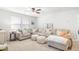 Comfortable living room with a large sectional sofa, plush ottomans, and plenty of natural light at 149 Caleb Ct, Ladson, SC 29456