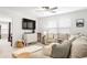 Inviting living room featuring plush seating, a large TV, and a ceiling fan for year-round comfort at 149 Caleb Ct, Ladson, SC 29456