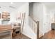 Cozy living room featuring a decorative ladder, stairs, sofa, and an open doorway to a hallway at 149 Caleb Ct, Ladson, SC 29456