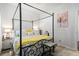 Charming bedroom features a canopy bed, decorative bedside tables, and bright natural lighting at 149 Caleb Ct, Ladson, SC 29456