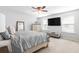 Bright and spacious main bedroom with neutral colors, a ceiling fan, and plenty of natural light at 149 Caleb Ct, Ladson, SC 29456