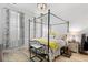 Cozy bedroom with a black canopy bed, decorative pillows, and light neutral walls at 149 Caleb Ct, Ladson, SC 29456