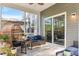 Relaxing covered patio with comfortable seating, ceiling fan, and sliding glass doors at 149 Caleb Ct, Ladson, SC 29456