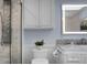 Modern bathroom featuring a marble countertop, illuminated mirror, and a rainfall shower at 1603 Ventura Pl, Mount Pleasant, SC 29464