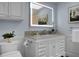 Elegant bathroom showcasing a custom vanity, marble countertop, and a large, lighted mirror at 1603 Ventura Pl, Mount Pleasant, SC 29464