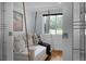 Stylish bedroom featuring a unique hanging daybed and serene decor at 1603 Ventura Pl, Mount Pleasant, SC 29464