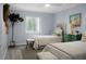 Charming bedroom featuring twin beds, a green dresser, and decor at 1603 Ventura Pl, Mount Pleasant, SC 29464