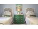 Charming bedroom featuring twin beds and a decorative green dresser at 1603 Ventura Pl, Mount Pleasant, SC 29464