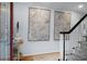 Elegant entryway featuring staircase, hardwood floors, and tasteful art decor at 1603 Ventura Pl, Mount Pleasant, SC 29464