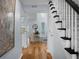 Open-concept entryway with hardwood floors leads to a cozy living area at 1603 Ventura Pl, Mount Pleasant, SC 29464