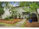 Charming two-story home features a well-maintained landscaped yard with a pathway to the front door at 1603 Ventura Pl, Mount Pleasant, SC 29464