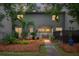 Charming two-story home features a well-maintained landscaped yard with a pathway to the front door at 1603 Ventura Pl, Mount Pleasant, SC 29464