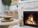 Elegant fireplace in living room, with mantle decor and golden accents at 1603 Ventura Pl, Mount Pleasant, SC 29464