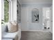Hallway view highlighting natural light, built-in shelves, and a glimpse into the bathroom at 1603 Ventura Pl, Mount Pleasant, SC 29464