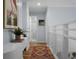 Well-lit hallway with hardwood floors and stylish decor at 1603 Ventura Pl, Mount Pleasant, SC 29464
