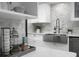 Close up of modern kitchen featuring quartz countertops, tile backsplash, and stainless steel sink at 1603 Ventura Pl, Mount Pleasant, SC 29464
