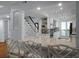 Open-concept kitchen featuring white cabinets, modern appliances, and a breakfast bar at 1603 Ventura Pl, Mount Pleasant, SC 29464