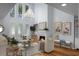 Bright living room with high ceilings, fireplace and a large chandelier at 1603 Ventura Pl, Mount Pleasant, SC 29464