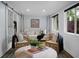 Cozy sunroom featuring a unique hanging daybed and stylish decor at 1603 Ventura Pl, Mount Pleasant, SC 29464