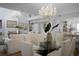 Open floor plan living spaces featuring hardwood floors and modern crystal chandeliers at 1603 Ventura Pl, Mount Pleasant, SC 29464
