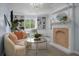 Comfortable sitting room with fireplace, chandelier and built-in shelving at 1603 Ventura Pl, Mount Pleasant, SC 29464