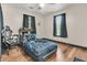 This is a bedroom with wood floors, a ceiling fan, and a black and blue comforter at 1628 Point Park Dr, Johns Island, SC 29455