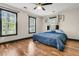 Comfortable bedroom features hardwood floors, ceiling fan and ample natural light at 1628 Point Park Dr, Johns Island, SC 29455
