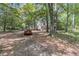 Scenic driveway leads to a charming home nestled among mature trees, offering privacy and a tranquil setting at 1628 Point Park Dr, Johns Island, SC 29455