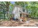 A charming home is nestled among mature trees, with an inviting porch and exterior that exudes classic appeal at 1628 Point Park Dr, Johns Island, SC 29455