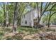 Home exterior with traditional siding, set in a serene wooded environment with mature trees, offering a private retreat at 1628 Point Park Dr, Johns Island, SC 29455