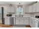 This kitchen features ample countertop space, stainless steel appliances, and new fixtures at 1628 Point Park Dr, Johns Island, SC 29455