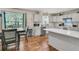 This bright eat-in kitchen is complete with stainless appliances and white countertops at 1628 Point Park Dr, Johns Island, SC 29455