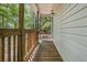 Inviting wooden porch provides a cozy outdoor space, complemented by the home's charming exterior details and lighting at 1628 Point Park Dr, Johns Island, SC 29455