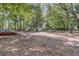 A yard with lush trees, a car, and a trampoline at 1628 Point Park Dr, Johns Island, SC 29455