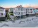 Beach home aerial of lovely home with multiple balconies and beach access nearby at 1681 E Ashley Ave # A, Folly Beach, SC 29439