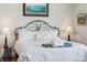 Comfortable bedroom with a decorative headboard and decorative pillow at 1681 E Ashley Ave # A, Folly Beach, SC 29439