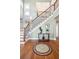 Elegant foyer with hardwood floors, staircase, and decorative table at 1681 E Ashley Ave # A, Folly Beach, SC 29439